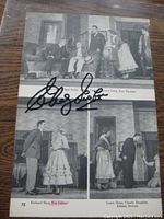 Full view of the black and white photo with Eva Gabor autograph.