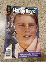 Front cover of Happy Days comic book showing Henry Winkler and Ron Howard on cover.