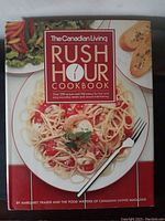 Front cover showing title and main food image of a plate of spaghetti with tomato sauce and garnishes
