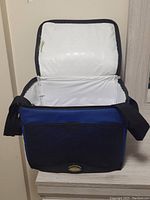 Front view of California Innovations Jumbo HardBody lunch box open to show interior and shoulder strap