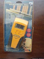 Front view of Zircon Studvision Pro stud finder in sealed packaging showing the device and features