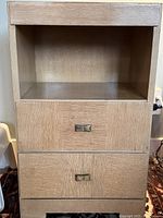 Front view showing open cubby and two drawers