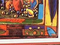 Close-up showing artist's signature and detailed colorful border of the print
