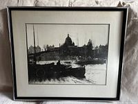 Full frontal photo of the framed vintage black and white photo of Victoria Harbour with boats and the Legislature Building in the background.
