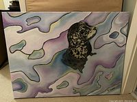 Full view of the painting showing the seal's head centered on a multicolored pastel abstract background on a stretched canvas.