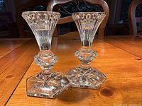 Pair of Waterford Crystal candlesticks, showing the crystal clear quality and flared top design with hexagonal base.