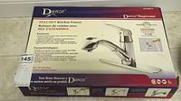 Box front showing Danze branding and product features with lifetime warranty