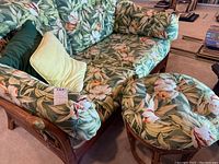 Front left angle view of loveseat with matching stool