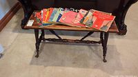 Bench and fanned sheet music booklets on top