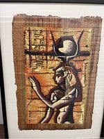 Full view of the papyrus painting showing the Ancient Egyptian woman carrying a gourd on her head with hieroglyphic wall background.