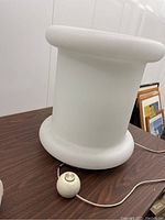 Side view of the lamp showing frosted glass shade and chrome base