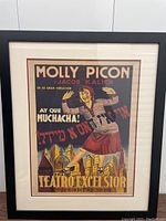 Framed full view of the colorful vintage Molly Picon and Jacob Kalich theatrical poster for Teatro Excelsior, featuring cityscape and central female figure illustration.