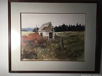 Framed original watercolour and egg tempera landscape painting showing rustic shack in a field with trees and mountains in distance.