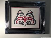 Framed silkscreen artwork fully wrapped in protective plastic showing overall condition.