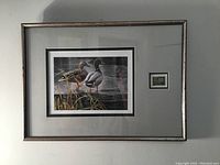 Full view of framed print with conservation stamp and matting.