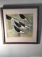Full view of framed lithograph showing five sandpipers at water's edge in a multicolor background with three-tone frame and white mat.