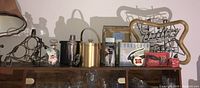 Photo showing the boxed deluxe corkscrews, combination decanter/aerator, Coca Cola bottle opener, drink shaker, ice buckets, bottle rack, and Neon Miller High Life sign.