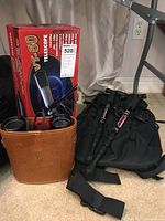 Full view of all items including boxed Vision VT-50 telescope, binoculars with leather case, hiking backpack and collapsible poles.