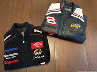 Both jackets folded, corduroy and leather visible