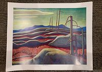 Full view of the colored print 'Lake Superior' by Lawren Harris with visible edition number and artist signature.