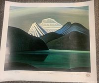 Full view of limited edition print showing stylized mountain landscape and lake, numbered 189/595, with artist signature and embossing stamps.