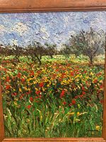 Full view of framed canvas showing poppy field under swirling sky