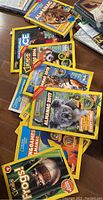 Photo showing multiple editions of National Geographic Kids Almanac and other educational children's books with colorful animal covers