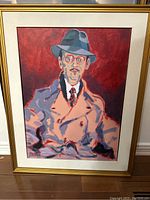 Front view of the framed acrylic painting showing a man in a fedora, trench coat, tie, and glasses against a red background.