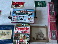 Wide shot showing all items including flags, game, books, and photo.