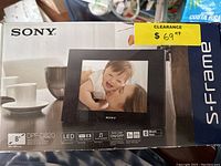 Sony S-frame digital picture frame box with product image, model DPF-D820, 8 inch screen, black.