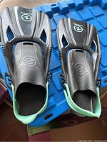 Pair of large/extra-large adult scuba flippers black and gray with green edge