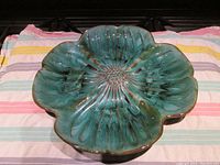 Full top view of flower shaped serving dish showing overall shape, glaze, and size.