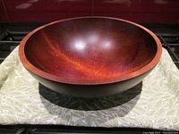 Top-down view of the large wooden serving bowl showing depth and interior wood grain.