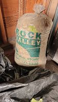 Full view of one sealed bag of Rock Valley Natural Stones with printed label visible.