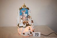 Full front view of the fiber optic lighted nativity scene showing the entire setup with power cord attached.