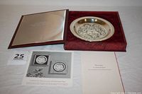 Plate in original opened box with red velvet lining, certificate and promotional flyer included.