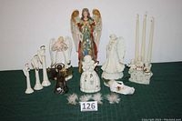 Front view of entire angel collection showing various sizes and designs, including the tall Joseph's Studio angel