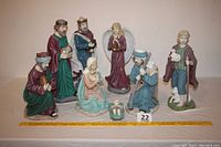 All eight nativity figurines arranged on a surface showing details and relative sizes.