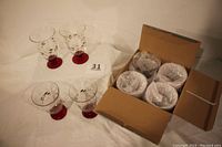 Four goblets wrapped and packed inside the original Pfaltzgraff Winterberry box showing packaging condition.