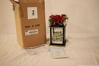 Full view of the lantern, Certificate of Authenticity, and original box included in the lot.