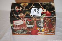 Box showing Twelve Days of Christmas beverage glasses set by Indiana Glass with holiday-themed packaging.