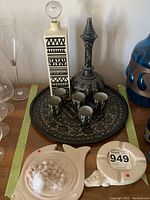 Overall set displayed on table including decanter, glasses, tray, ashtray, and game piece.