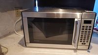 Front view of the Danby stainless steel microwave showing the door, size, and overall condition.