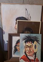 Set of four original First Nation inspired paintings by S. Blyth, various sizes, one framed with cracked glass