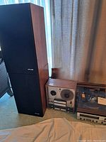 Wide shot of Pioneer speakers, reel-to-reel (not included), turntable and receiver