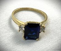 Top view showing rectangular cut sapphire and side diamonds