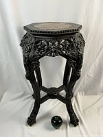 Full view of octagonal rosewood side table with marble top, showing overall design and proportions.