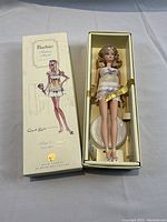 Box open showing doll in cell