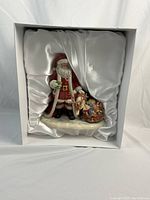 Santa figurine nestled in satin-lined Royal Doulton box