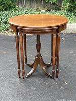 Three mahogany tables nested together front view